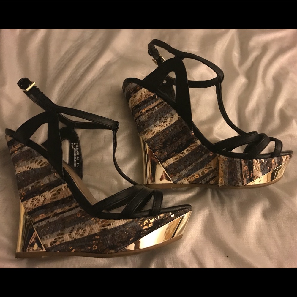 Sheek and Shiny Wedge with Black Straps.